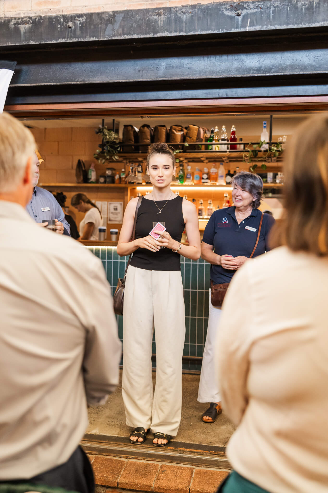 Business people get up to discuss who they are and what their business at a local event.