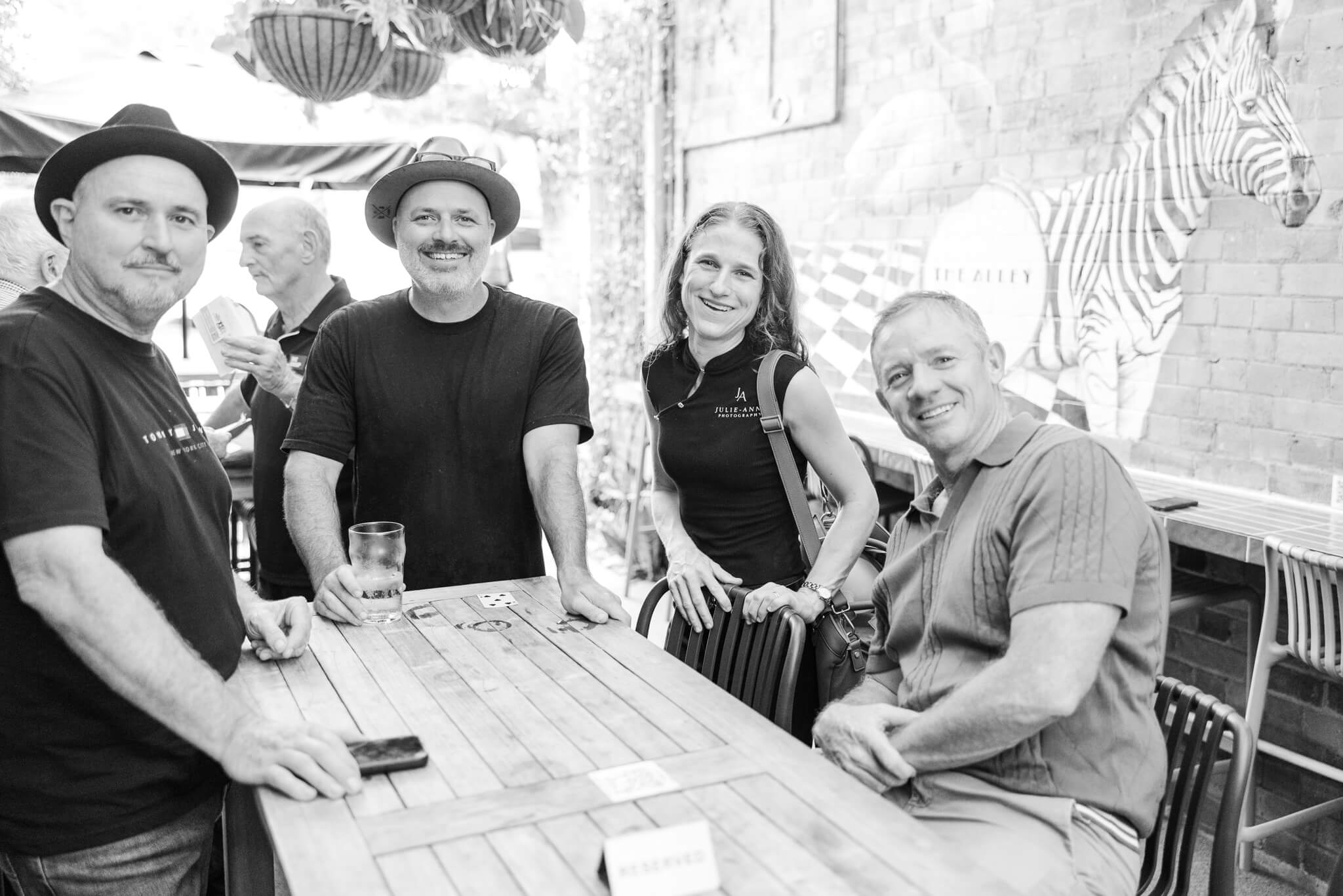 Business members meet to network at The Alley Yeppoon.  Black and white image of the event featuring some of the attendees.
