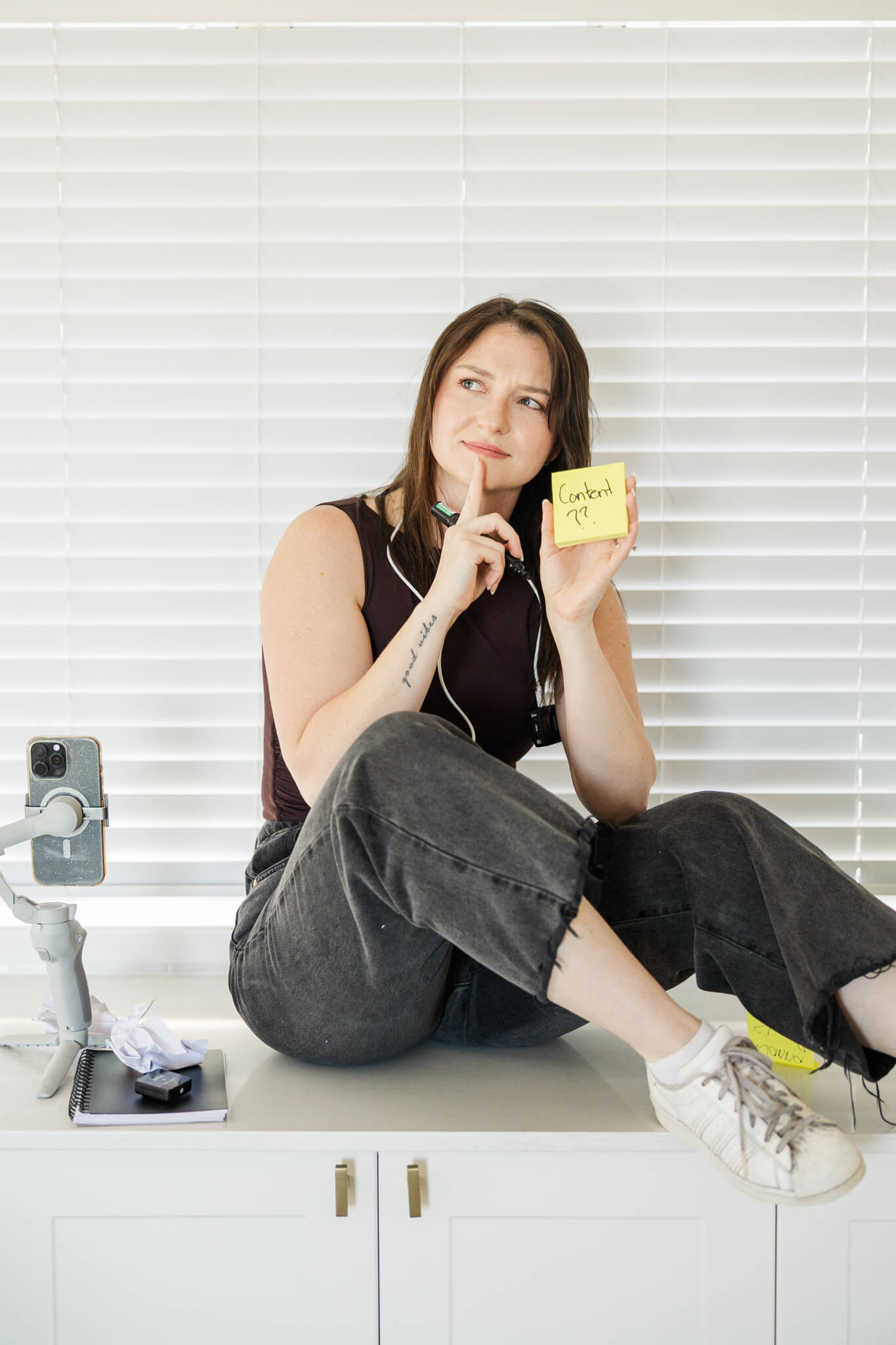 Content creator poses for her personal branding photos to help people connect to her story and what she has to offer.