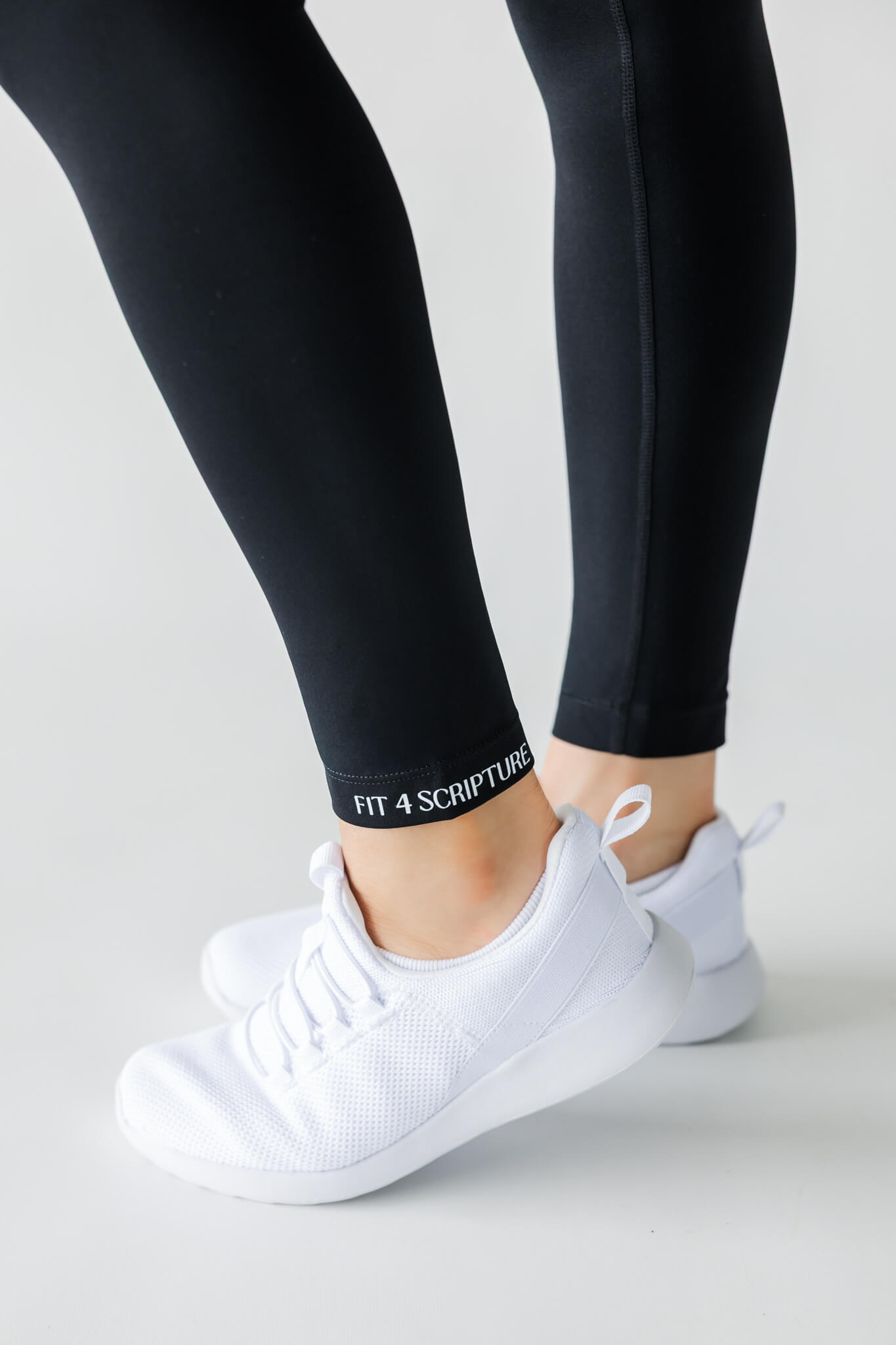 Studio product photography showcasing details of fitness leggings.