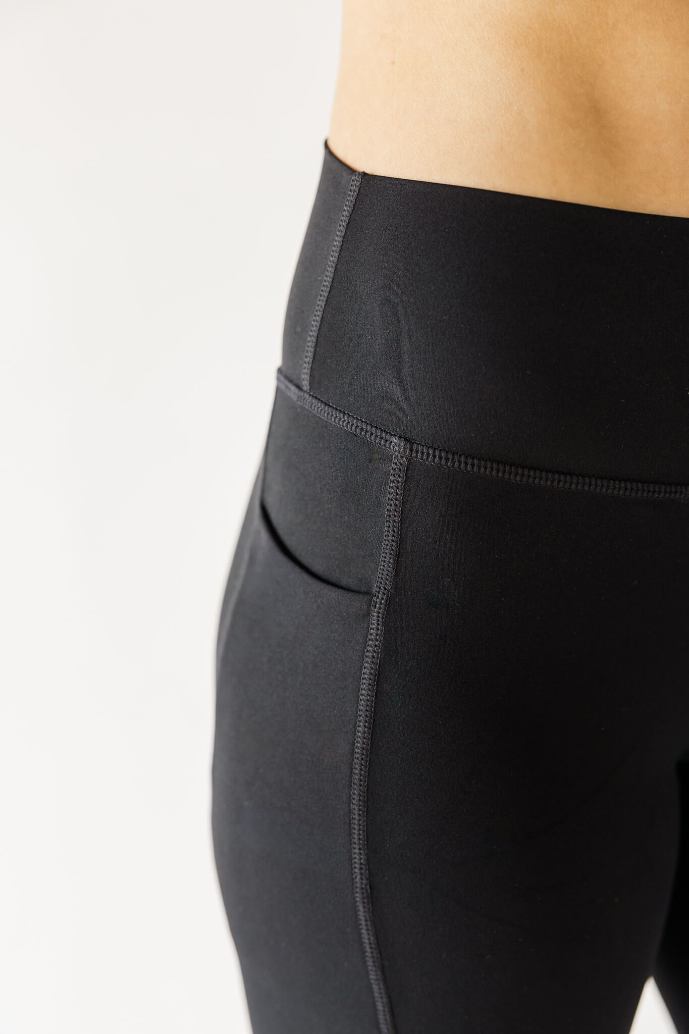 Studio product photography showcasing details of fitness leggings.