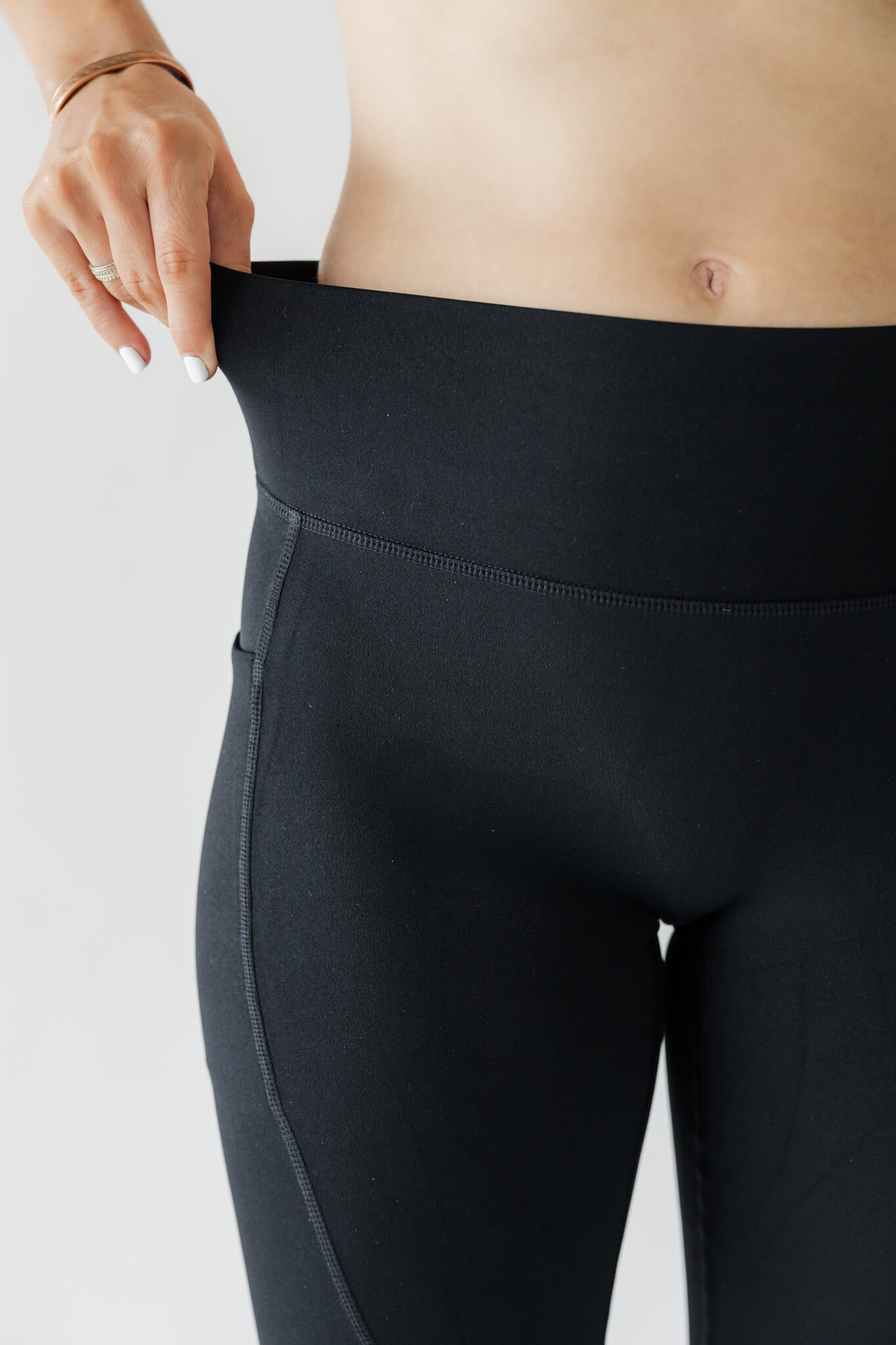 Studio product photography showcasing details of fitness leggings.
